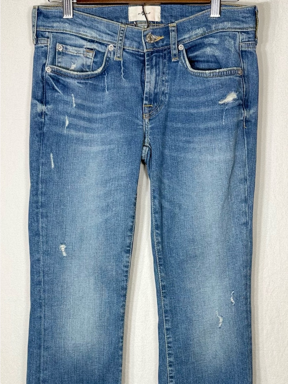 7 For All Mankind Light Blue Bootcut Jeans with Distressed Detailing